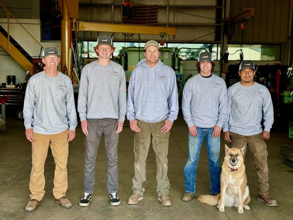 Skilled welding team of J&M Welding Inc. at work in Paso Robles shop, employing advanced MIG and TIG welding techniques on diverse metal projects.