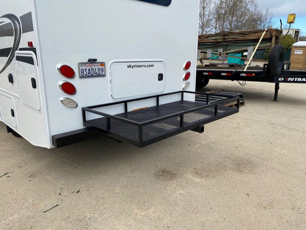 Custom storage rack for the back of a camper, designed to increase hauling capacity and organize gear with high-quality metal construction.