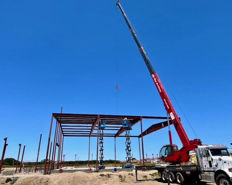 Mid-project photo of structural steel components being assembled on-site at the City of Guadalupe storage facility.