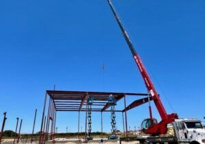 Mid-project photo of structural steel components being assembled on-site at the City of Guadalupe storage facility.